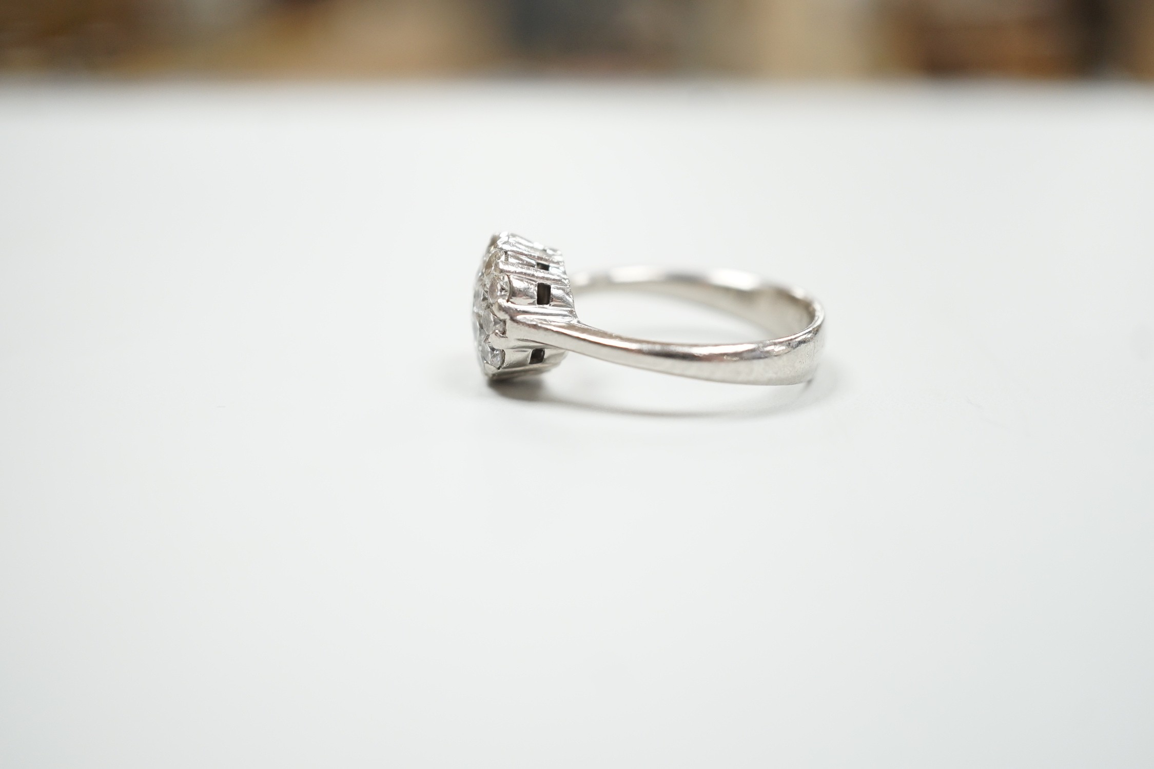 A modern Alito platinum and hexagonal cluster ring, size O, gross weight 8.4 grams.